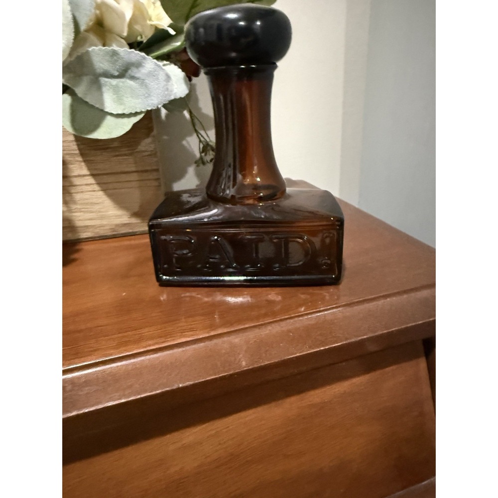 Vintage Avon "PAID" stamp glass decanter bottle from the early 1970s